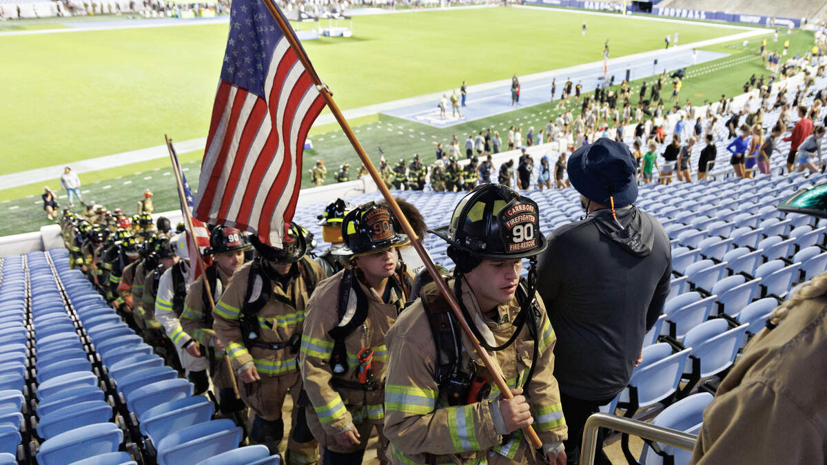 Participants climb the stairs of Kenan Memorial Stadium during an event on Thursday, Sept. 11, 2025, to honor those who lost their lives during attacks of Sept. 11, 2001.