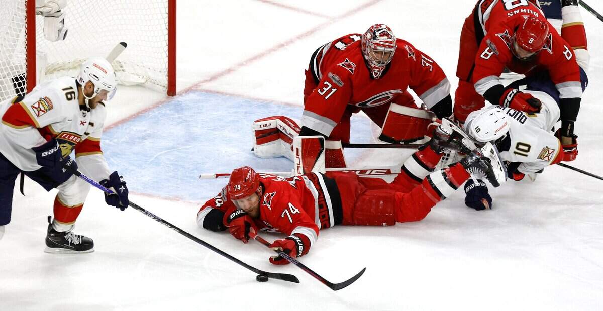 Carolina defenseman Jaccob Slavin (74) defends Florida center Aleksander Barkov (16) during the first overtime of the Hurricanes’ game against the Panthers in the first game of Eastern Conference Finals at PNC Arena in Raleigh, N.C., on Thursday, May 18, 2023.