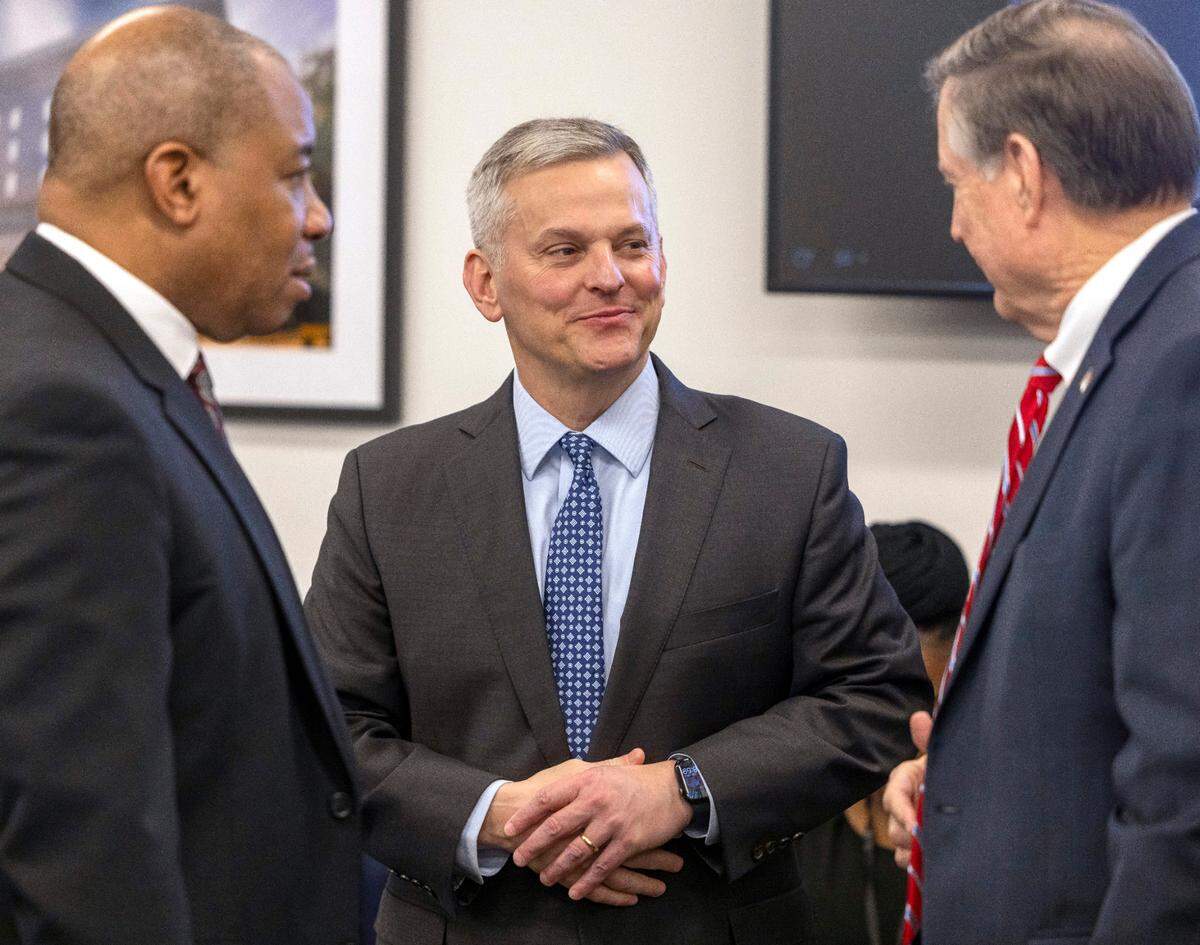North Carolina Governor Josh Stein talks with Commissioner of Insurance Mike Causey, right, and Supt. Of Public Instruction Mo Green, prior to the Council of State meeting on Tuesday, February, 4, 2025 in Raleigh, N.C.