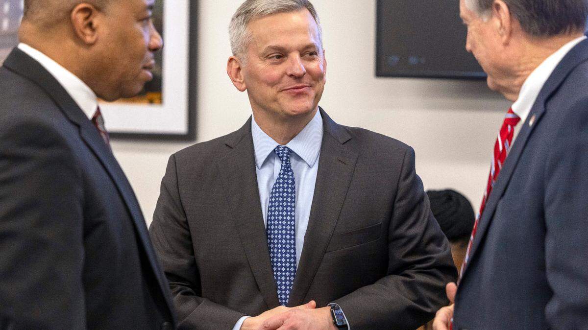 North Carolina Governor Josh Stein talks with Commissioner of Insurance Mike Causey, right, and Supt. Of Public Instruction Mo Green, prior to the Council of State meeting on Tuesday, February, 4, 2025 in Raleigh, N.C.