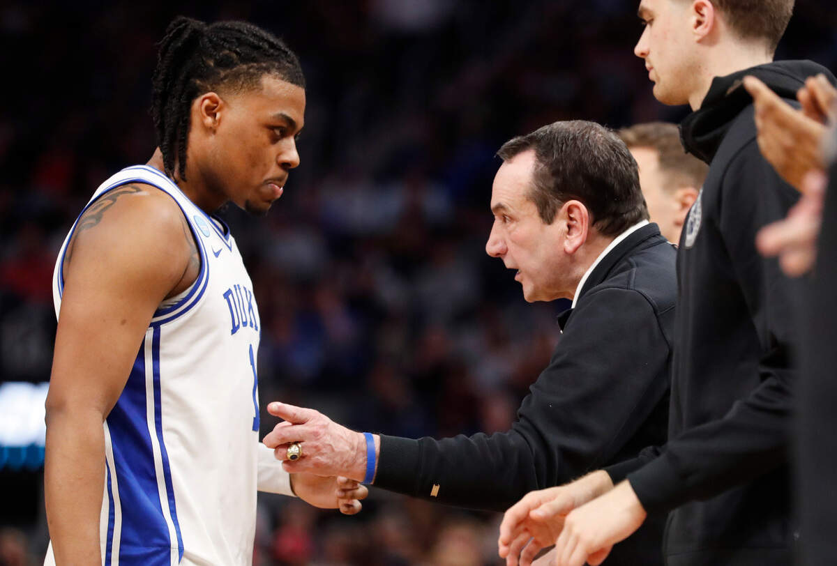 Duke head coach Mike Krzyzewski talks with Trevor Keels (1) during the second half of Duke’s 78-69 victory over Arkansas in the NCAA Tournament West Regional finals at the Chase Center in San Francisco, Calif., Saturday, March 26, 2022.