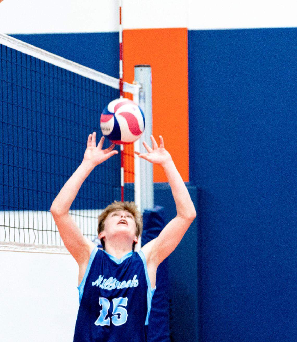 Connor Hartley goes up to hit the ball for Millbrook High School at the 2024 Boys High School Volleyball State Championship held May 2024 at Carolina UVC in Charlotte.