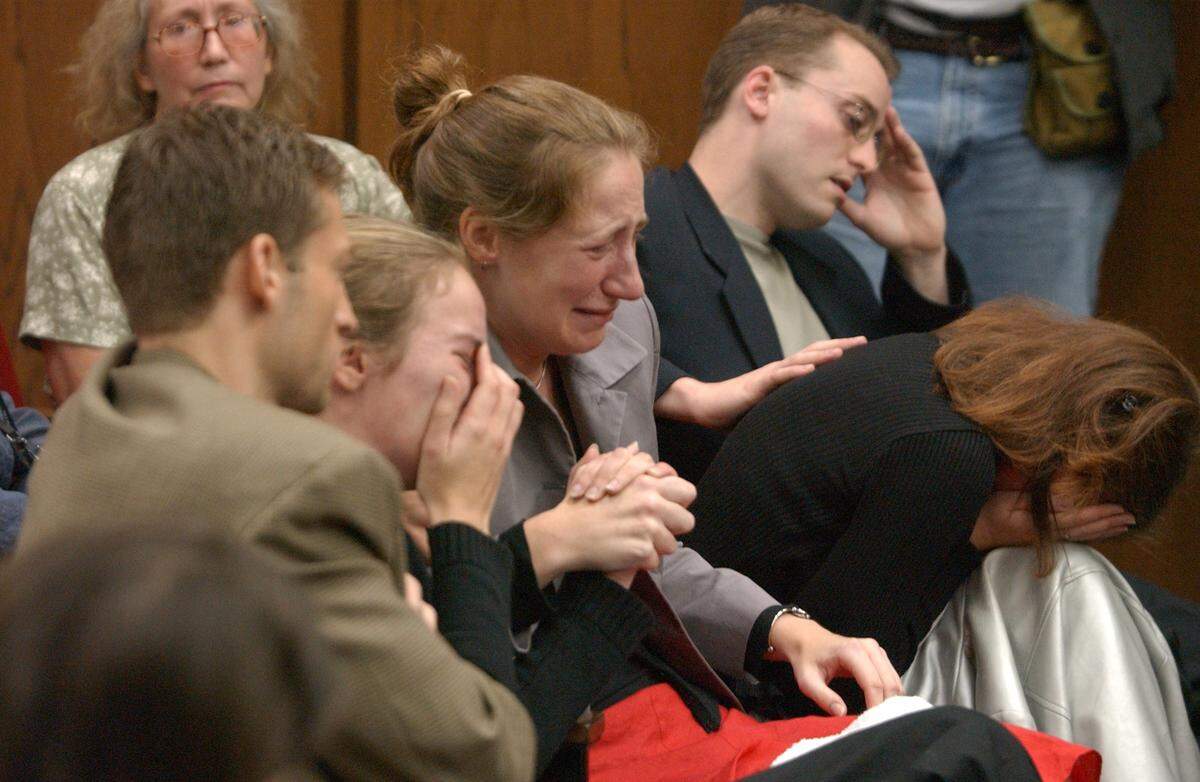 Members of Michael Peterson’s family and friends from left: Todd Peterson, Martha Ratliff, Margaret Ratliff, Becky Seibert (leaning forward, head on lap) and Clay Peterson are devastated after Michael Peterson was led away in handcuffs upon being convicted of the first degree murder of his wife Kathleen Peterson. Todd and Clay are Peterson’s sons, Martha and Margaret are Peterson’s adopted daughters/he is their guardian, and Seibert is Clay Peterson’s girlfriend. Michael Peterson’s first wife, Patti Peterson in left background.