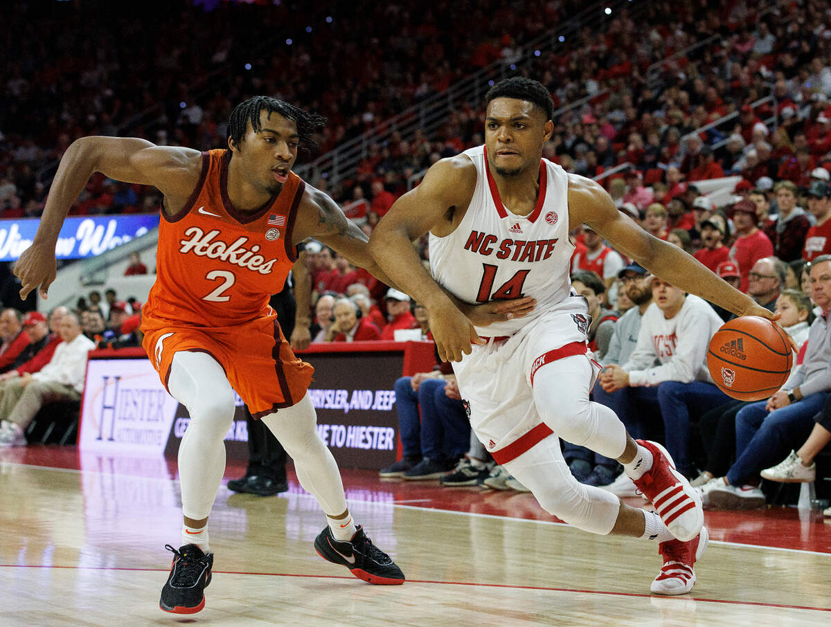 N.C. State’s Casey Morsell pushes the ball past Virginia Tech’s MJ Collins during the first half of the Wolfpack’s 84-78 loss on Saturday, Jan. 20, 2024, at PNC Arena in Raleigh, N.C.