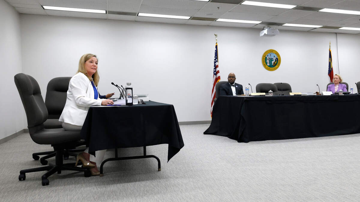 Ousted N.C. State Board of Elections Executive Director Karen Brinson Bell, left, makes a statement after the board adjourned their meeting in downtown Raleigh, N.C., on Wednesday, May 7, 2025. Brinson Bell asked to give farewell remarks before the meeting ended, but new Republican board member Bob Rucho moved to adjourn the meeting before she could do so. She stayed behind in the conference room to address the audience and the board’s two Democratic members, who did not leave after adjournment.