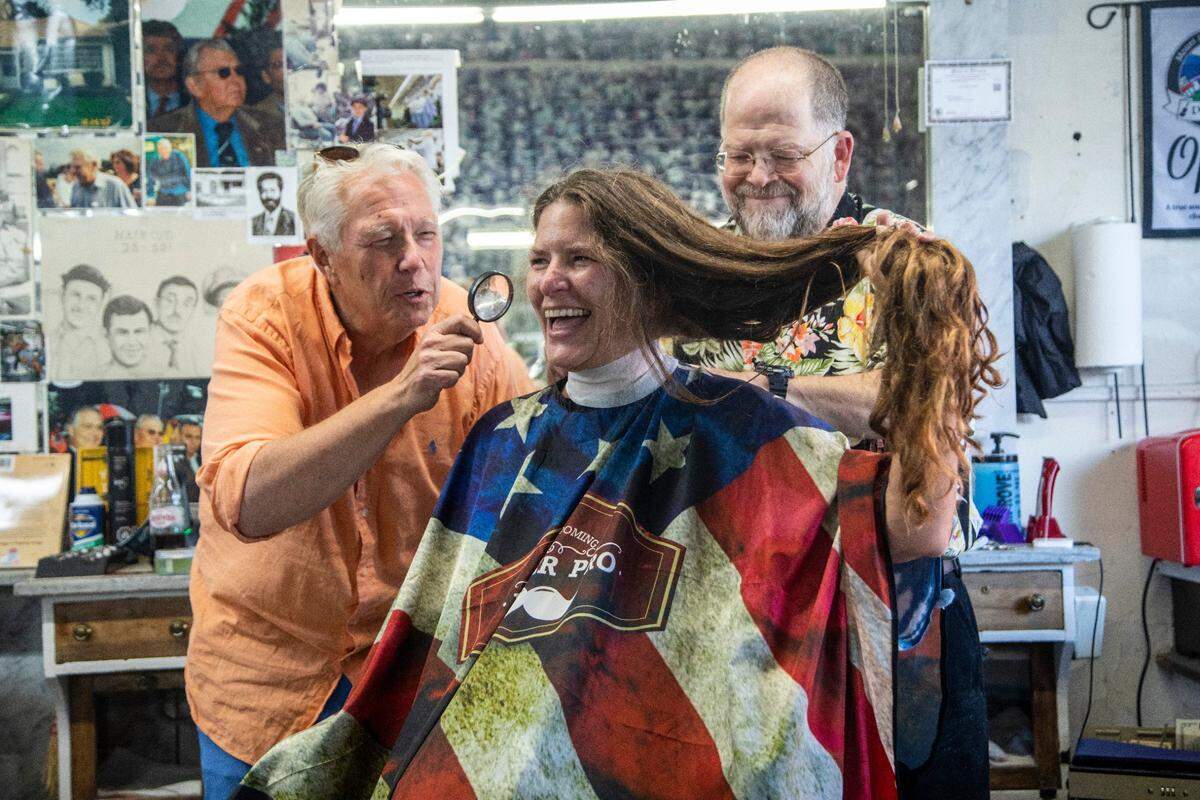 News & Observer reporter Martha Quillin gets a haircut at Floyd's Barber Shop in downtown Mount Airy.
