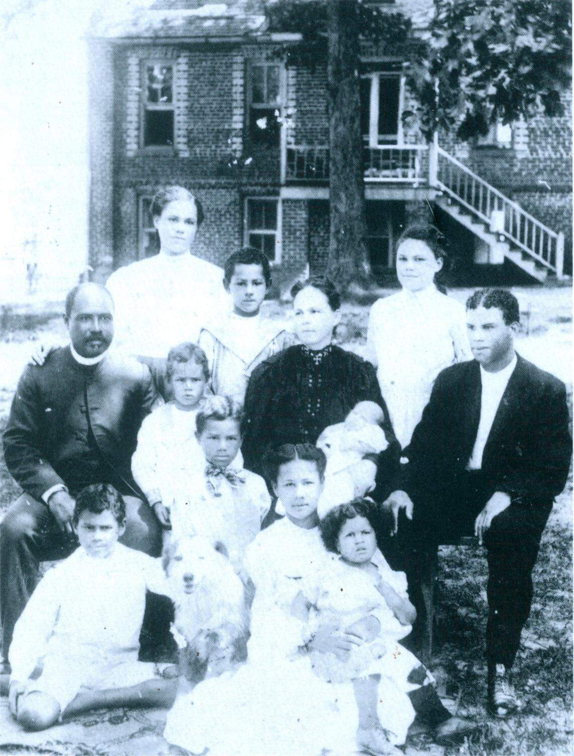 The Delany family, about 1906 in front of the Delany Cottage at Saint Augustine’s School. Sadie Is in back next to her father, Bessie in front holding her sister Laura.