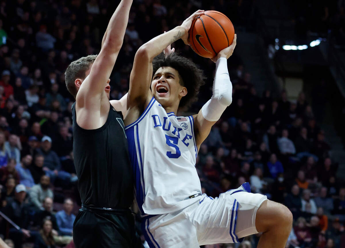 Duke’s Tyrese Proctor (5) shoots as Virginia Tech’s Sean Pedulla (3) defends during the second half of Virginia Tech’s 78-75 victory over Duke at Cassell Coliseum in Blacksburg, VA., Monday, Jan. 23, 2023.