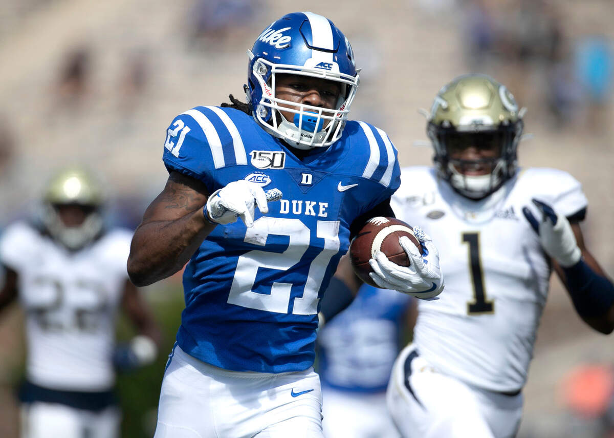Duke’s Mataeo Durant (21) rushes for 38-yards ahead of Georgia Tech’s Georgia Tech’s Tariq Carpenter (2) to set up a second quarter Duke touchdown on Saturday October 12, 2019 at Wallace Wade Stadium in Durham, N.C.