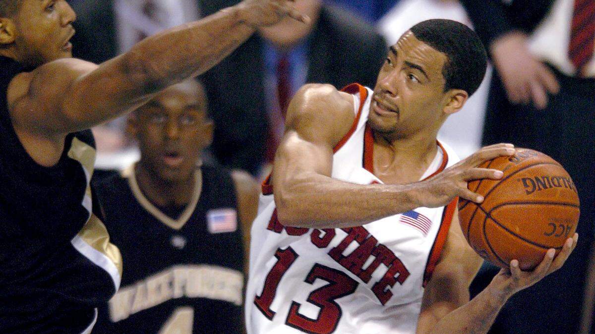 N,.C. State’s Cameron Bennerman in defended by Wake Forest’s Chris Ellis during the 2006 ACC Tournament in Greensboro, N.C.