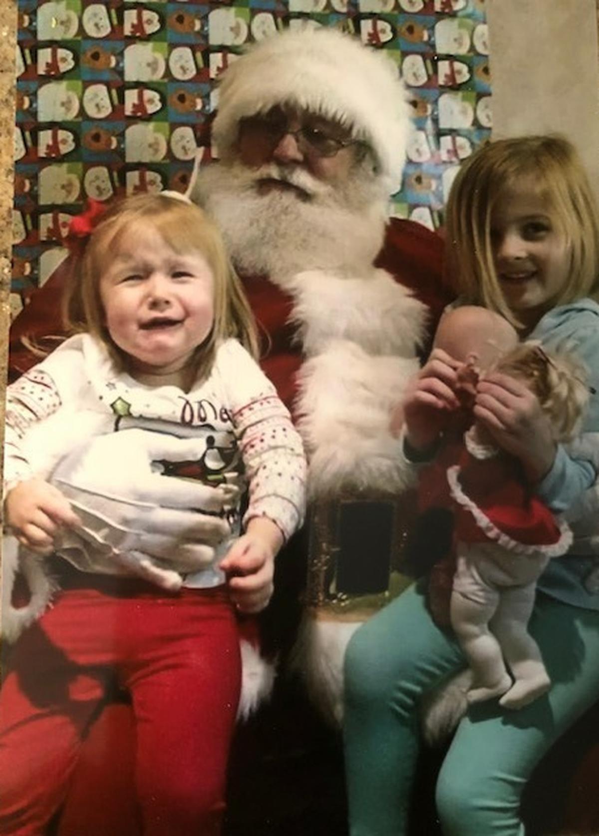 Nancy Ritchie’s grandchildren with Santa.