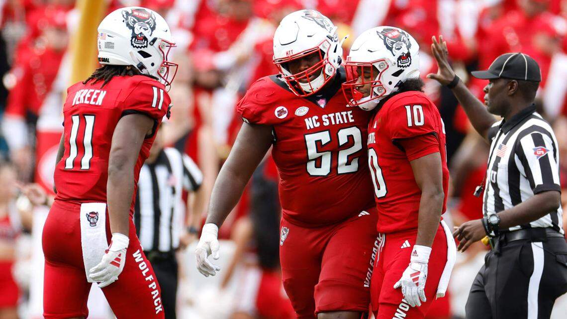 N.C. State’s Juice Vereen (11) and offensive lineman Timothy McKay (52) talk with KC Concepcion (10) after a pass intended for him was intercepted during the second half of Notre Dame’s 45-24 victory over N.C. State at Carter-Finley Stadium in Raleigh, N.C., Saturday, Sept. 9, 2023.