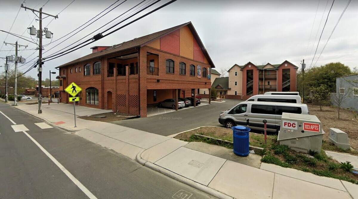 The CASA-owned Club Nova Apartments (at rear) at 103 W. Main Street is tucked behind the Club Nova clubhouse (left). Although some Club Nova members live at the low-income apartment building, the entities are not affiliated.