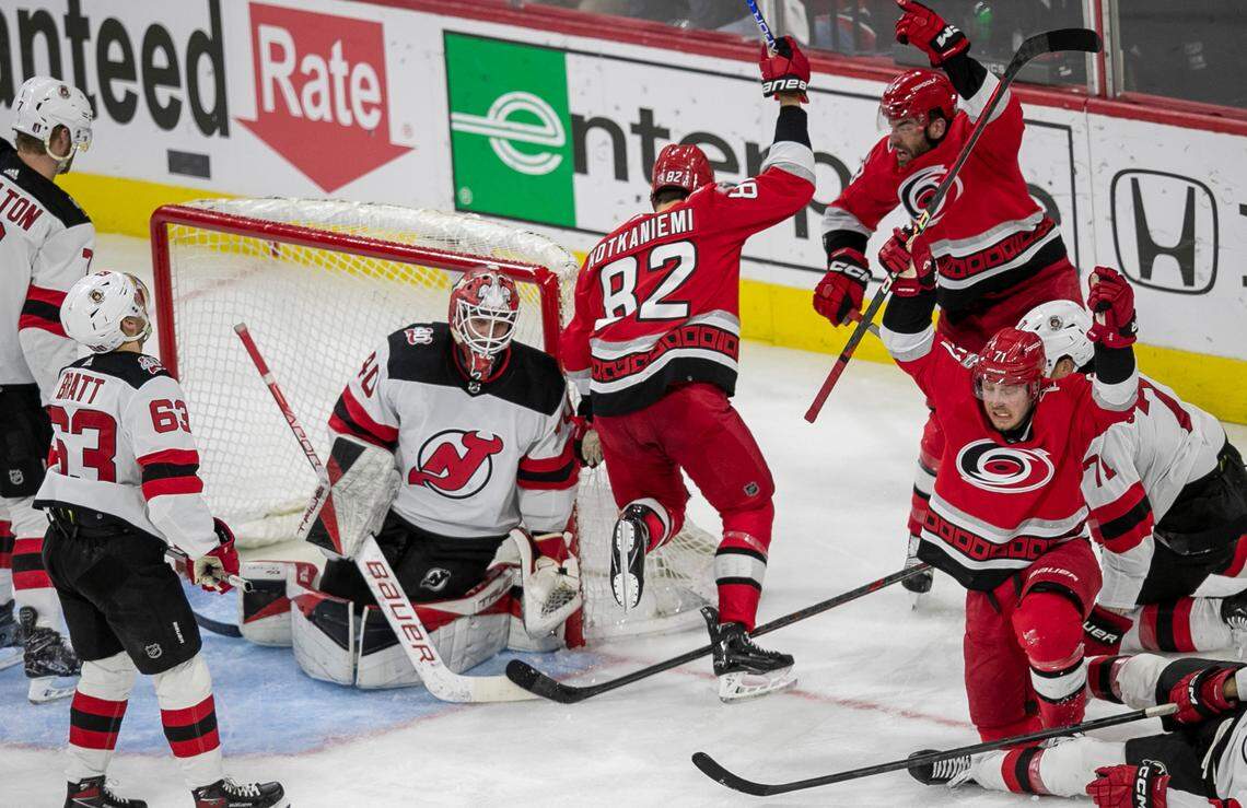 The Carolina Hurricanes Jesperi Kotkaniemi (82) scores the second of his two goals on New Jersey Devils goalie Akira Schmid (40) in the second period during Game 2 of their second round Stanley Cup playoff series on Friday, May 5, 2023 at PNC Arena in Raleigh, N.C.