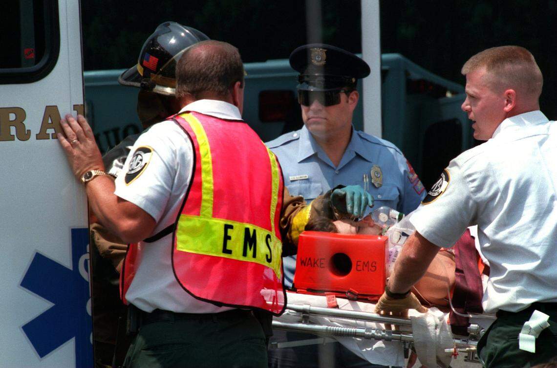 Wake EMS workers prepare to transport Tracy Bullis who was injured by the bomb blast at the BTI building in July 1995..