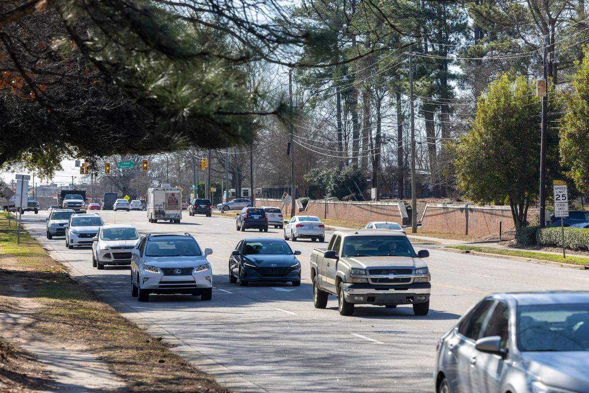 Traffic on Six Forks Road adjacent to Carroll Middle School on Wednesday, February 21, 2024 in Raleigh, N.C. The Raleigh City Council has approved improvements to this segment of Six Forks Road between Carroll Middle School and Millbrook Road that will widen the street to three travel lane and add a median The project includes construction of bike and pedestrian lanes on each side of the road.
