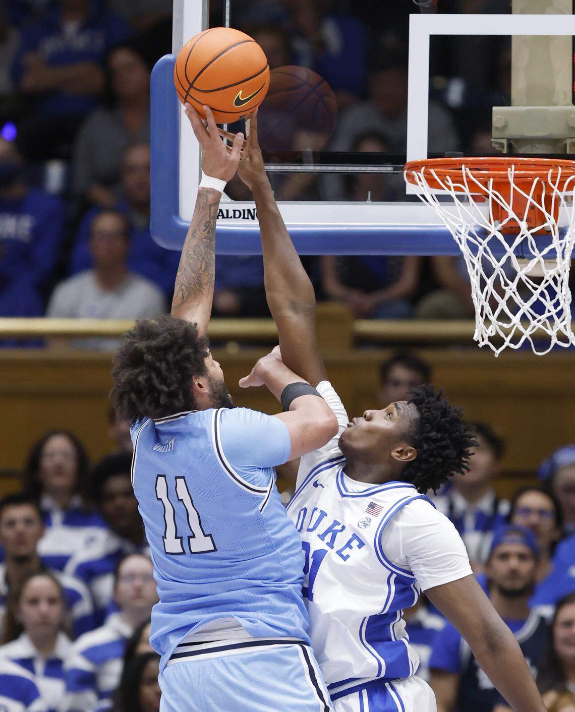 Duke’s Patrick Ngongba II (21) blocks the shot by Indiana State's Markus Harding (11) during the second half of Duke’s 100-62 victory over Indiana State at Cameron Indoor Stadium in Durham, N.C., Friday, Nov. 14, 2025.