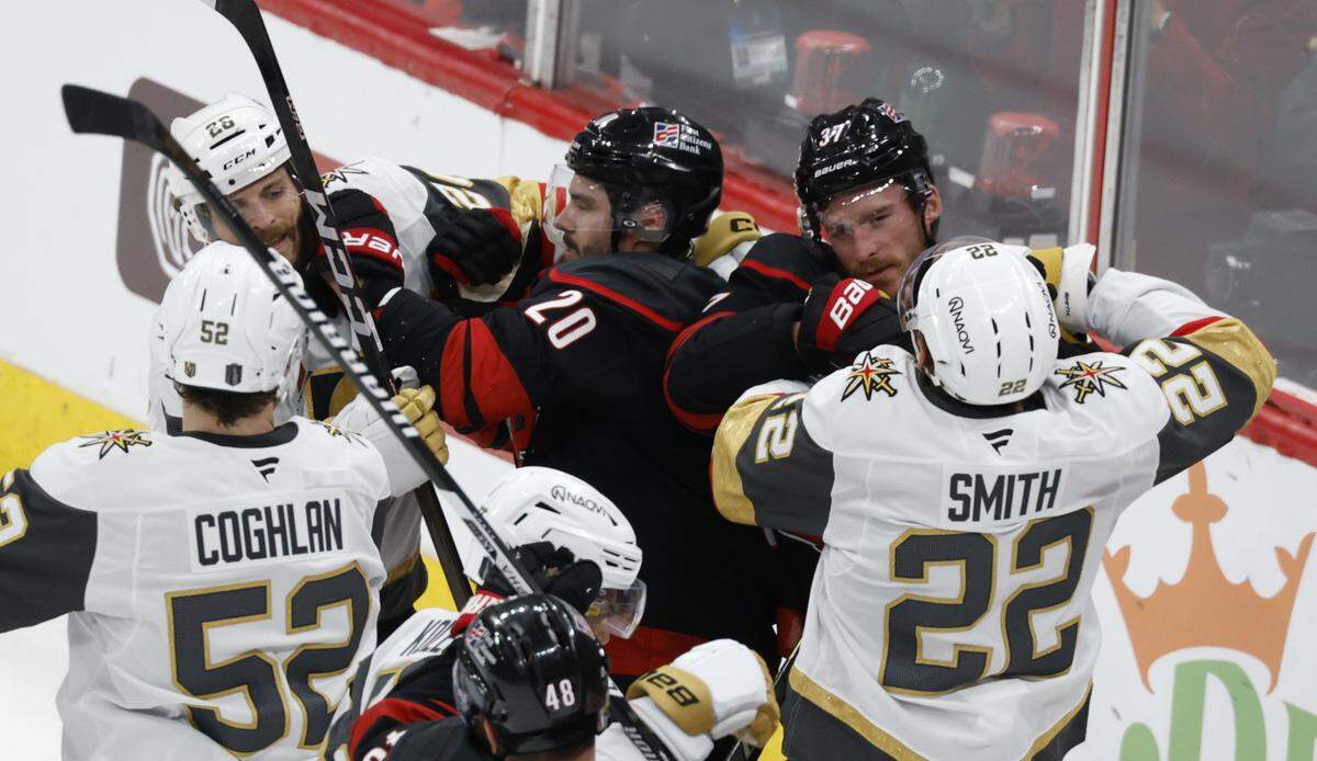 Carolina's Sebastian Aho (20) tangles with Vegas’ Nic Dowd (26) as Carolina's Andrei Svechnikov (37) tangles with Vegas’ Cole Smith (22) in the second period of the Hurricanes’ game against the Golden Knights in the second game of the Stanley Cup Final at the Lenovo Center in Raleigh, N.C., Thursday, June 4, 2026.