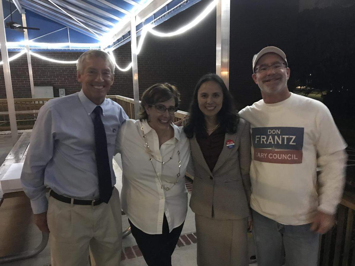 Mayor Harold Weinbrecht and town council members Lori Bush, Ya Liu, and Don Frantz, photographed on Tuesday night, Oct. 8 after winning each of their Cary elections.