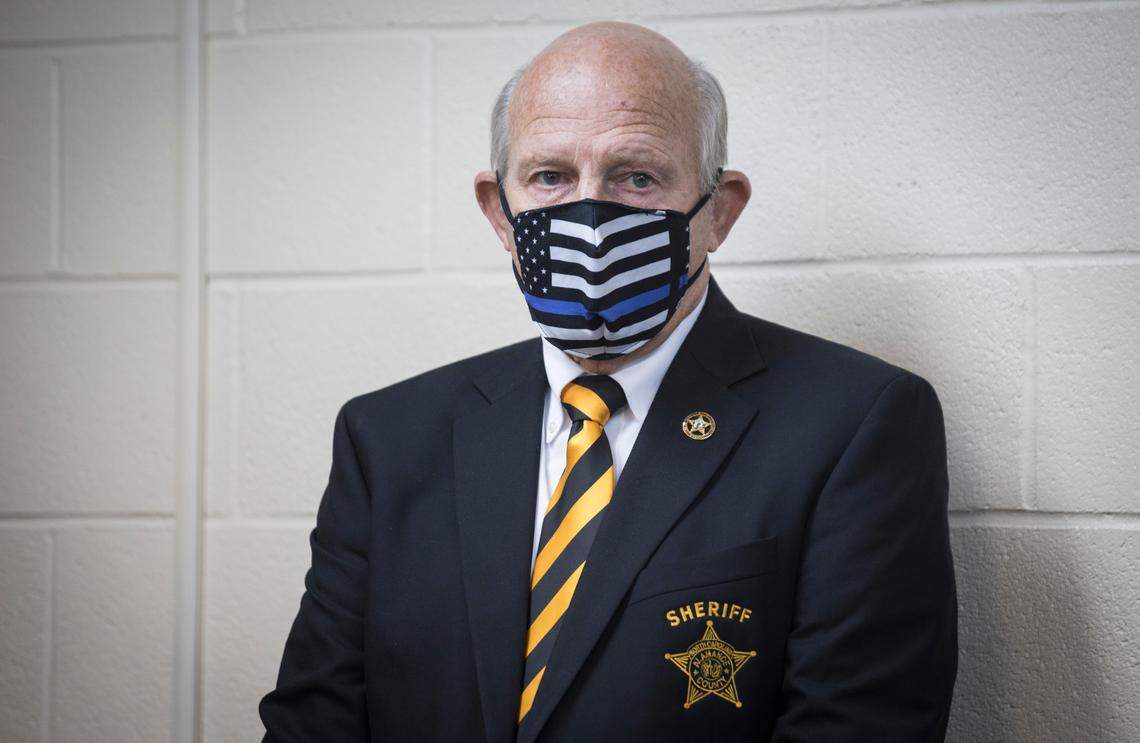 Alamance County Sheriff Terry Johnson listens as a statement is given to the press by his office in Graham, N.C. on Monday, Nov. 2, 2020 about the march in Graham on Saturday in which people were pepper-sprayed and arrested.