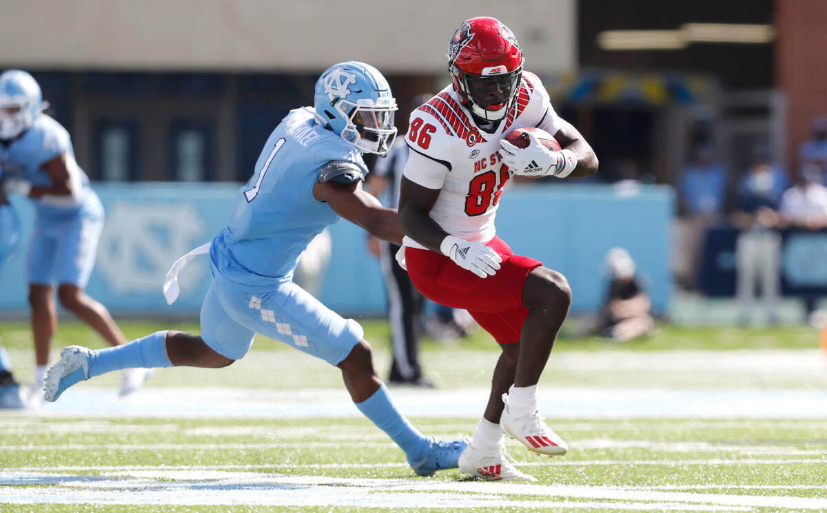 N.C. State wide receiver Emeka Emezie (86) beats to North Carolina defensive back Kyler McMichael (1) to score on a 42-yard touchdown during the first half of N.C. State’s game against UNC at Kenan Stadium in Chapel Hill, N.C., Saturday, Oct. 24, 2020.