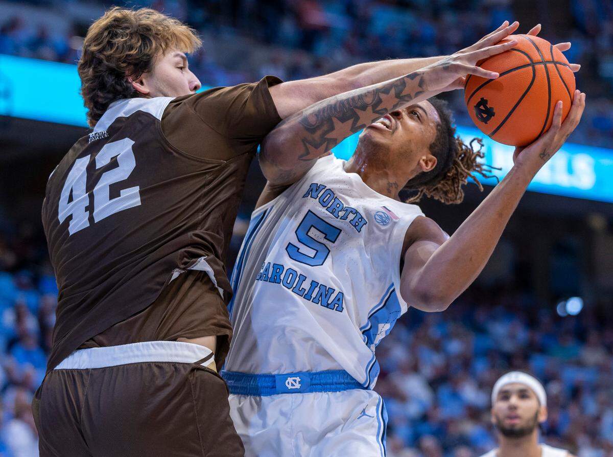 North Carolina’s Armando Bacot (5) muscles his way to the basket against Lehigh’s J.T. Tan (42) in the first half on Sunday, November 12, 2023 at the Smith Center in Chapel Hill, N.C.