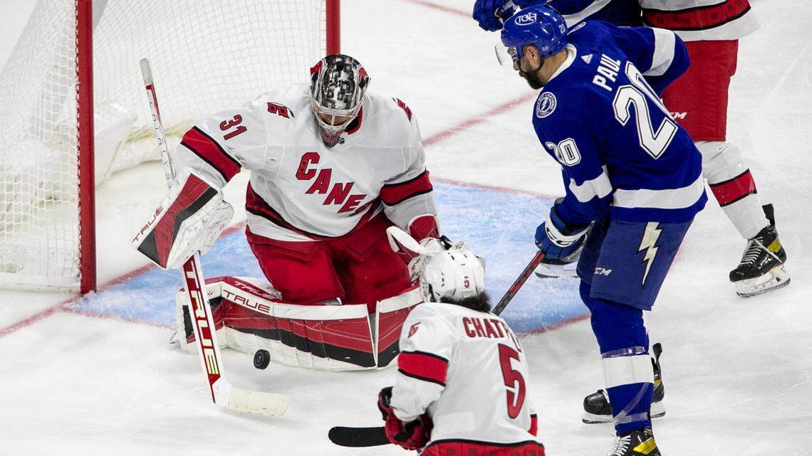 Carolina Hurricanes goalie Frederik Andersen (31) stops a shot by Tampa Bay’s Nick Paul (20) during the second period of an NHL preseason game on Tuesday, September 27, 2022 at PNC Arena in Raleigh, N.C.