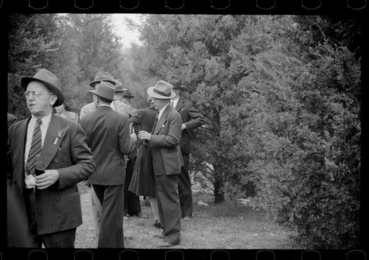Fans drinking at halftime of the Duke-Carolina game in Durham, NC in 1939.
