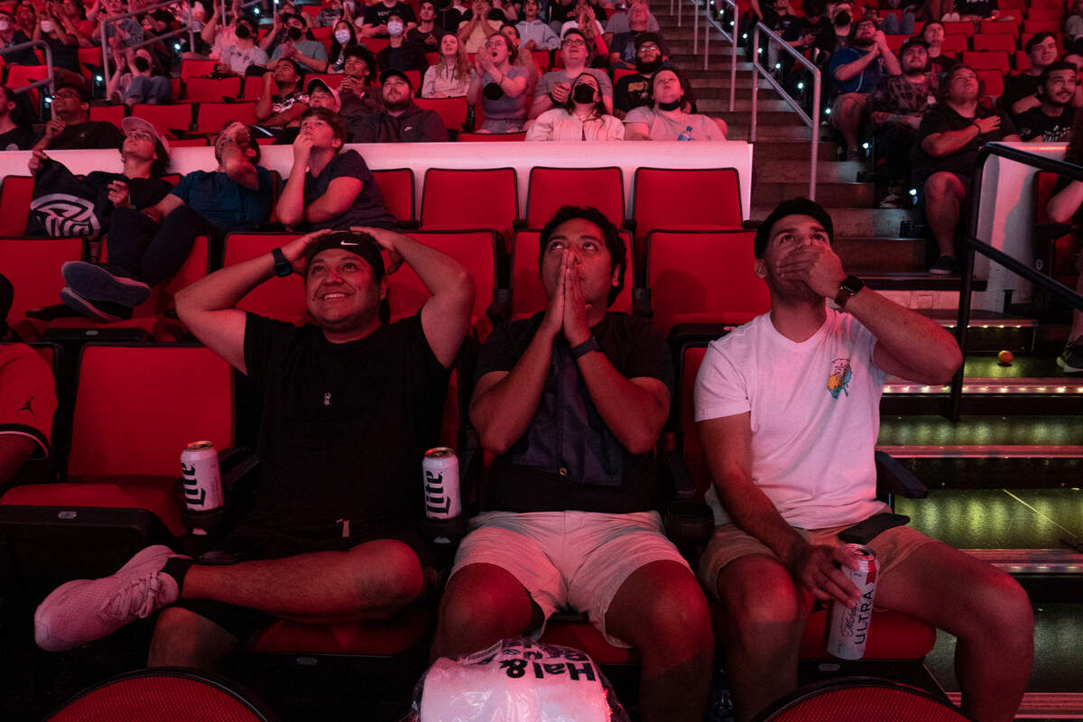 Bruno Ramirez, Emmanuel Ramirez and Brian Lerma, three team TSM fans from Charlotte, N.C. react during one of TSM’s rounds at the Apex Legends Global Series Championship at the PNC Arena in Raleigh, N.C. on Thursday, July 7, 2022.