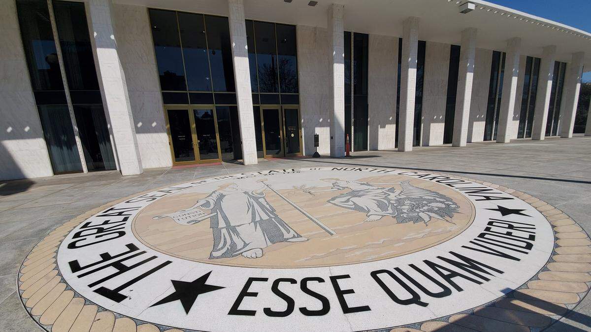 The North Carolina Legislative Building, with state seal in foreground, is pictured in March 2021.