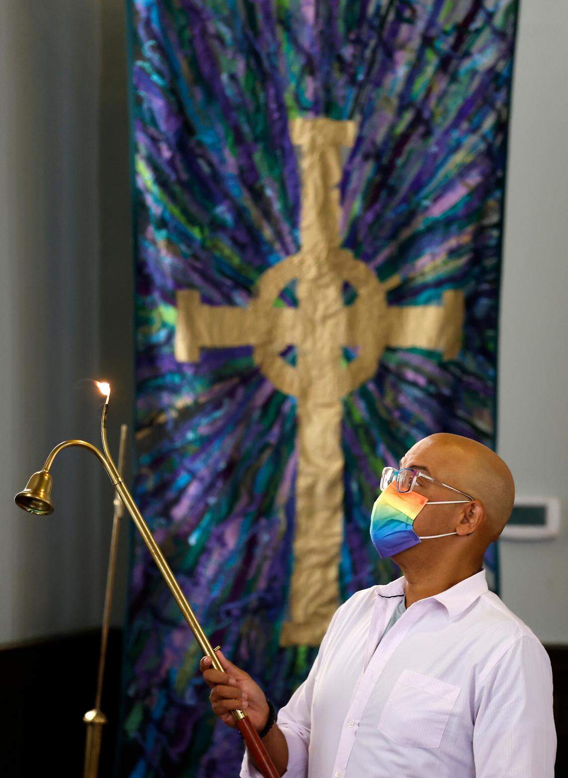 Cody Hamilton serves as an acolyte during a service of Elizabeth Street United Methodist Church on Sunday, July 31, 2022, in Durham, N.C.