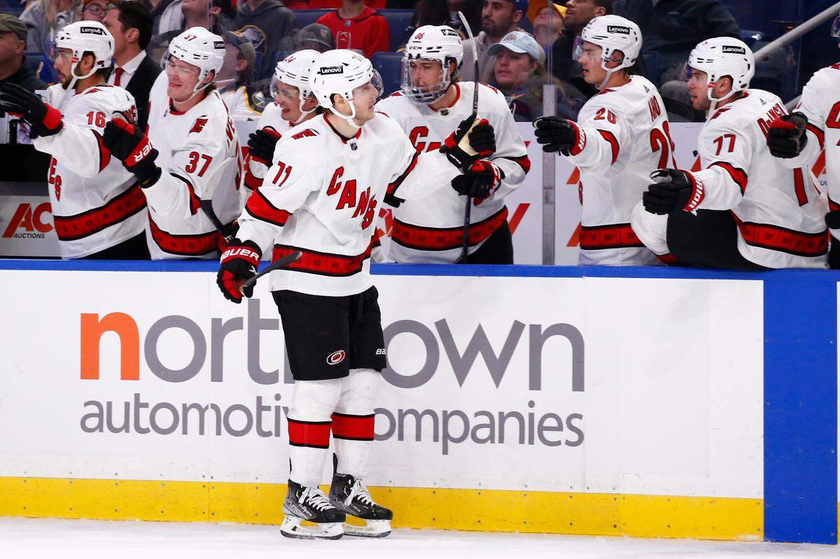 Carolina Hurricanes right wing Jesper Fast is congratulated for his goal during the first period of an NHL hockey game against the Buffalo Sabres, Tuesday, April 5, 2022, in Buffalo, N.Y. (AP Photo/Jeffrey T. Barnes)