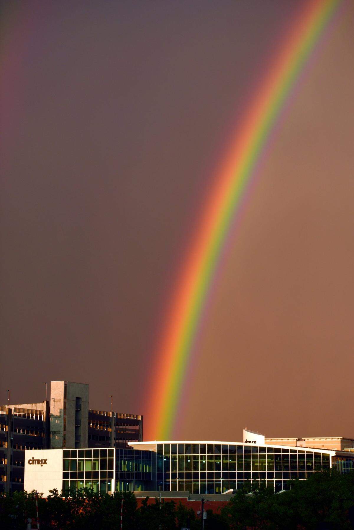 A file photo shows a rainbow over downtown Raleigh and the Citrix offices. The $16.5 billion all-cash acquisition of Citrix, which employs around 700 people in downtown Raleigh, will take the company private, removing the companyÕs shares from the publicly traded Nasdaq stock exchange. The deal also includes the assumption of CitrixÕs debt.