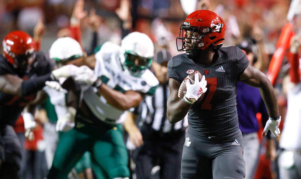 N.C. State running back Zonovan ‘Bam’ Knight (7) heads downfield to score on a 46-yard touchdown run during the second half of N.C. Stateís 45-0 victory over USF at Carter-Finley Stadium in Raleigh, N.C., Thursday, Sept. 2, 2021.