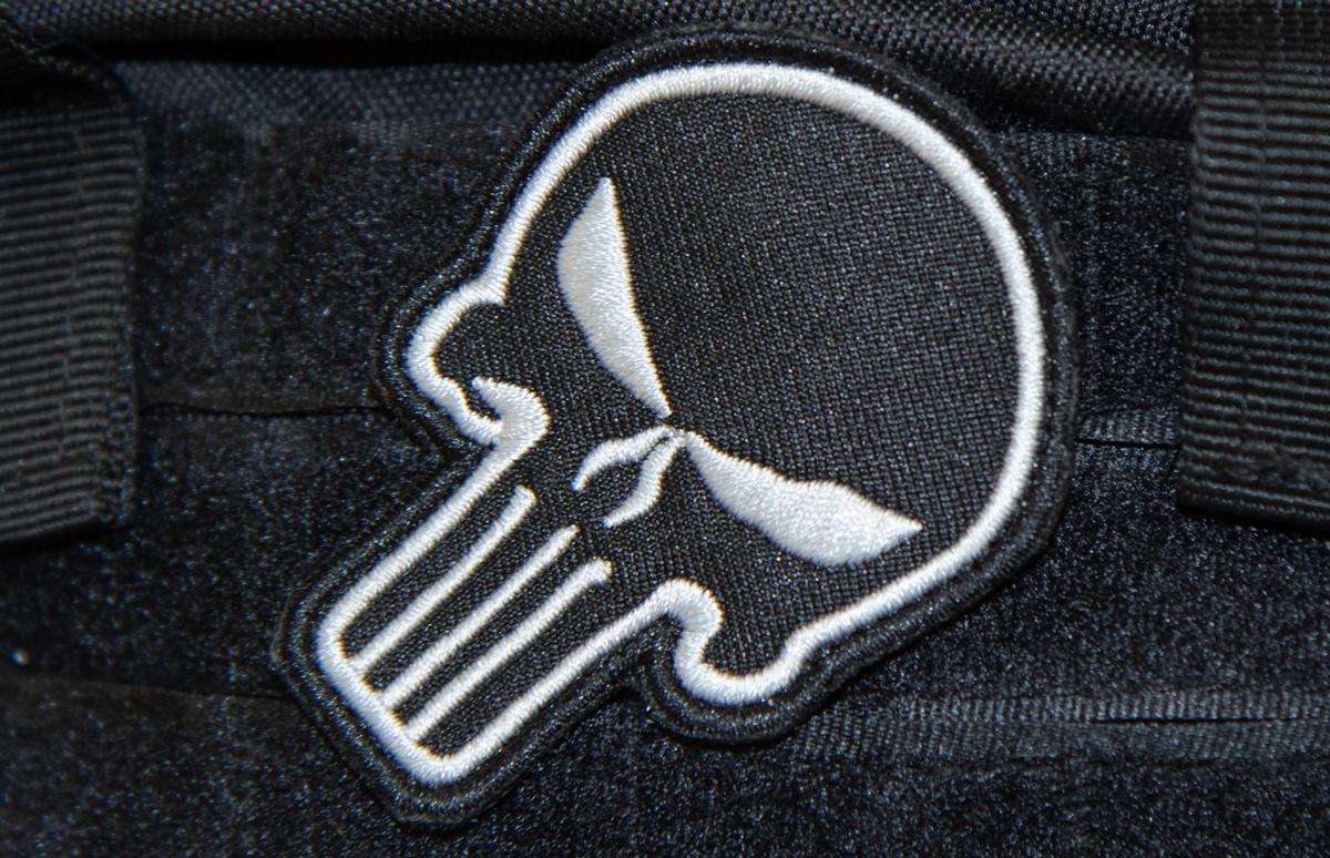 A Durham man dressed in law enforcement-type clothing was found walking in the hallways at New Hope Elementary School in Hillsborough. The man wore a vest bearing a “Punisher” patch on the front and a large “Sheriff” patch on the back.