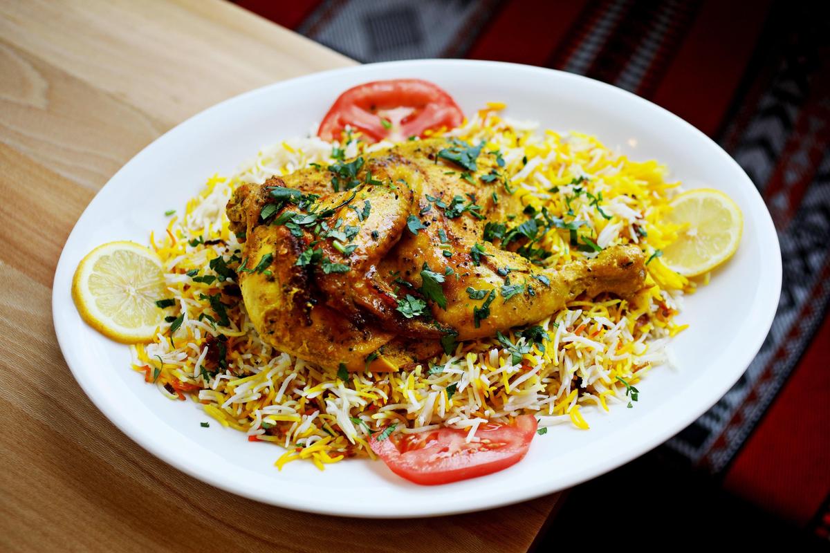 Yemen Kitchen’s chicken mandi is served as a half bird, slow-roasted and served on a nest of basmati rice spangled with a few turmeric yellow grains, and fried onion threads.