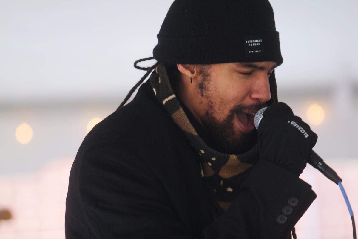 Pierce Freelon performs Jan. 15, 2022, at the unveiling of a new pop-up museum at Dorothea Dix Park in Raleigh. His late father, Phil Freelon, was a renowned architect who is featured in an exhibit at the park.
