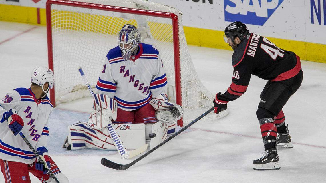 Carolina Hurricanesí Jordan Martinook (48) works against New York Rangers goalie Igor Shesterkin (31) during the second period on Thursday, May 26, 2022 during game five of the Stanley Cup second round at PNC Arena in Raleigh, N.C.