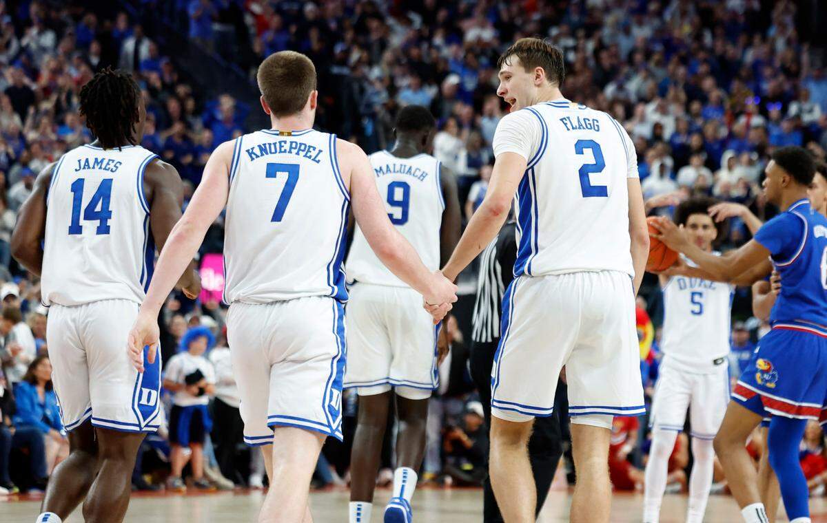 Duke’s Cooper Flagg (2) talks with Kon Knueppel (7) after Knueppel turned the ball with three seconds left in the game during Kansas’ 75-72 victory over Duke in the Vegas Showdown at T-Mobile Arena in Las Vegas, Nev., Tuesday, Nov. 26, 2024.