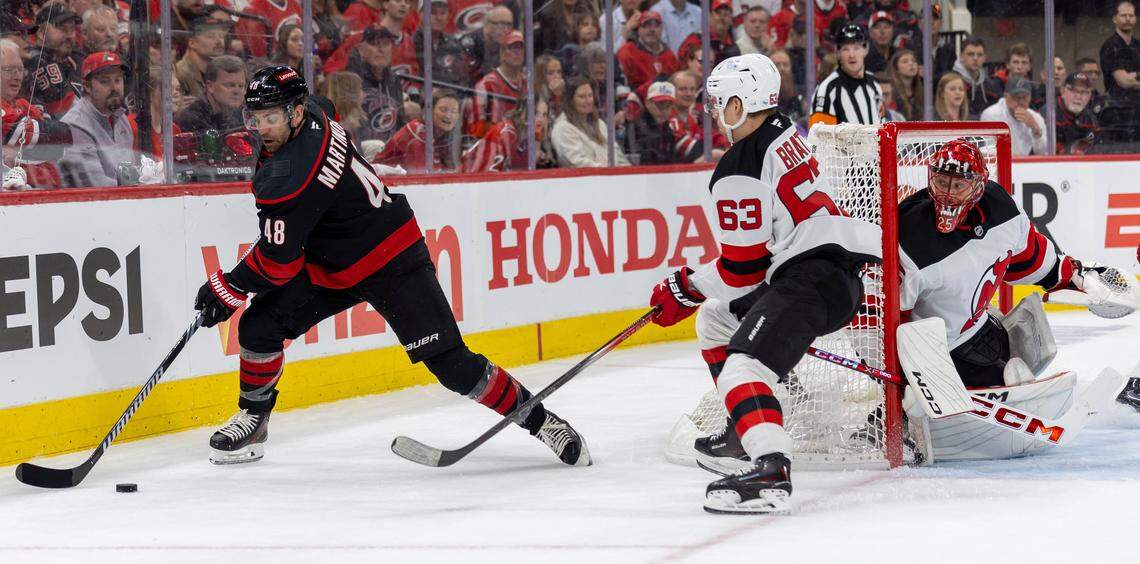 Carolina Hurricanes left wing Jordan Martinook (48) works behind New Jersey DevilsÕ goalie Jacob Markstrom (25) in the first period during game two of their Stanley Cup playoff series on Tuesday, April 22, 2025 at Lenovo Center in Raleigh, N.C.