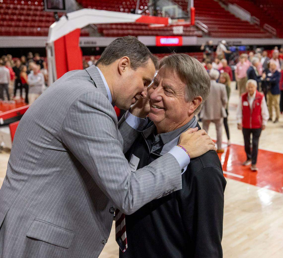 New N.C. State men’s basketball coach Will Wade embraces women’s basketball coach Wes Moore following his introduction on Tuesday, March 25, 2025 at Reynolds Coliseum in Raleigh, N.C.
