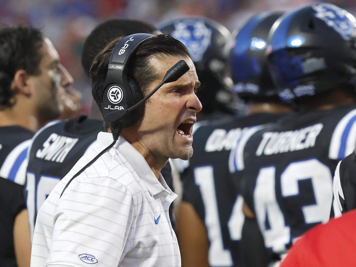 Duke head coach Manny Diaz speaks with an official during the second half of the Blue Devils’ 45-33 win over N.C. State on Saturday, Sept. 20, 2025, at Wallace Wade Stadium in Durham, N.C.