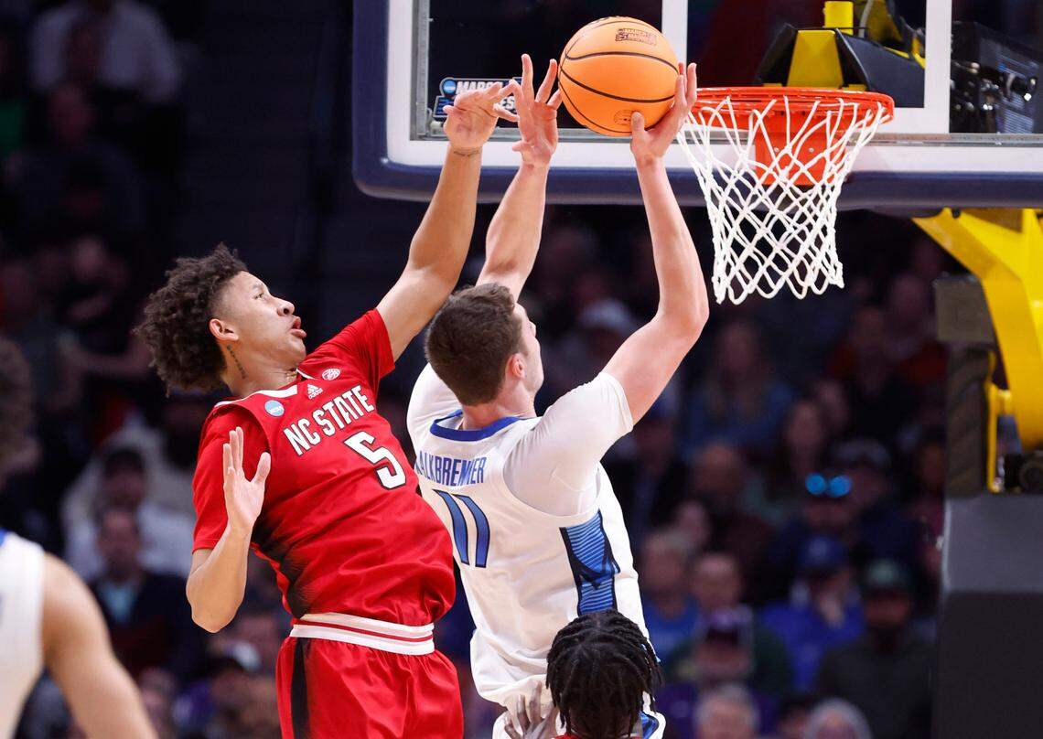 N.C. State’s Jack Clark (5) defends Creighton’s Ryan Kalkbrenner (11) during the first half of N.C. State’s game against Creighton in the first round of the NCAA Tournament at Ball Arena in Denver, Colo., Friday, March 17, 2023.