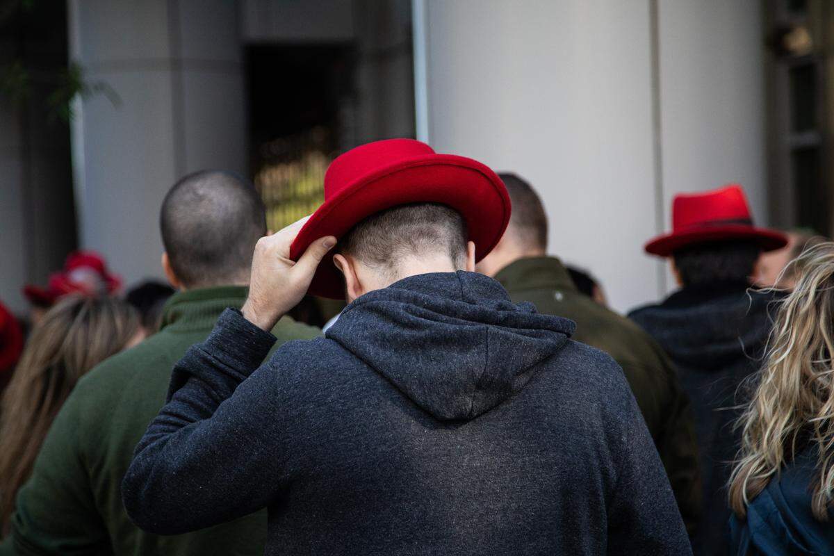 Red Hat employees walk back to their Raleigh headquarters after a meeting at the Duke Energy Center for the Performing Arts Monday, Oct. 29, 2018.