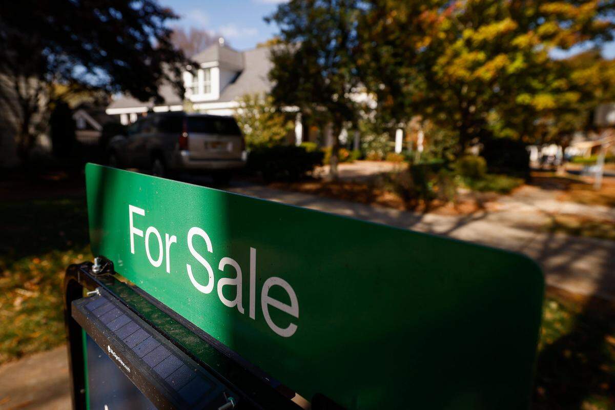 A for rent sign sits in front of a house on Circle Avenue in Charlotte, N.C., Friday, Nov. 4, 2022.