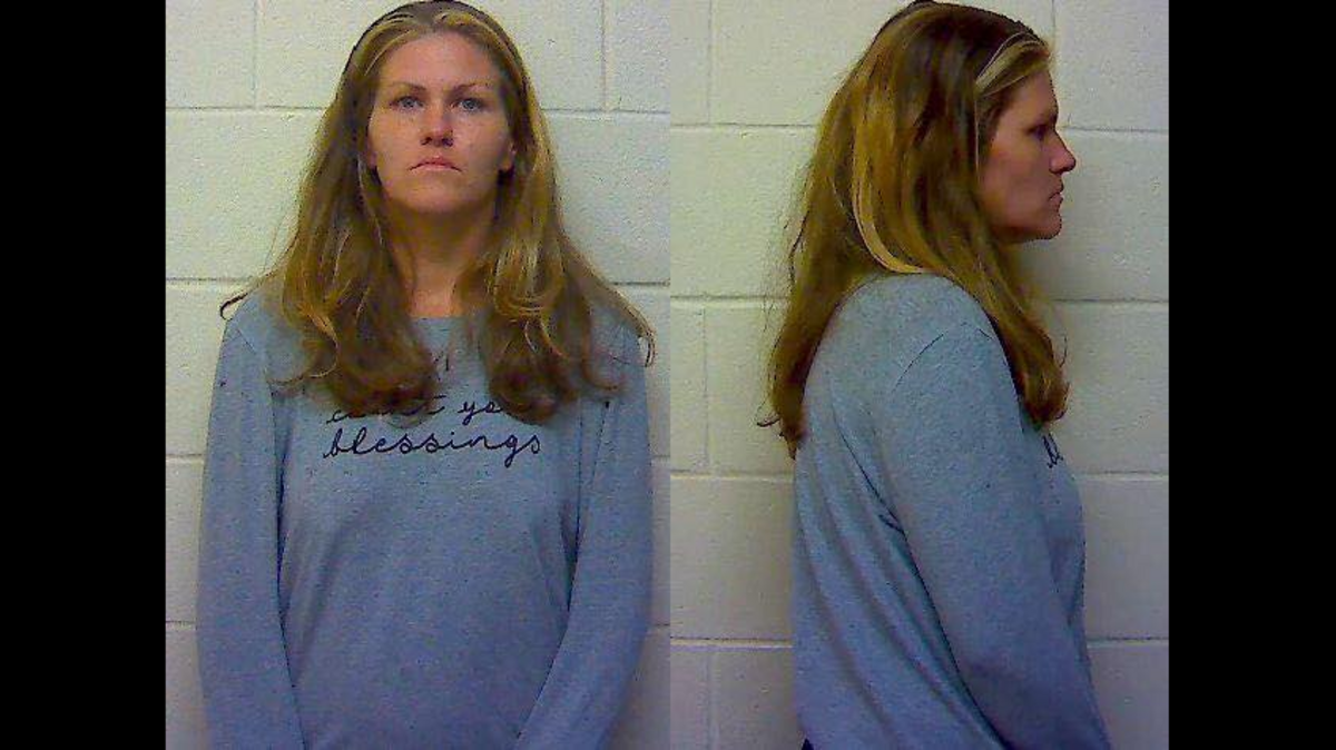 Lisa Partington, 38, is charged with child abuse after police say she was using heroin outside a Waffle House while a small child was in the car.