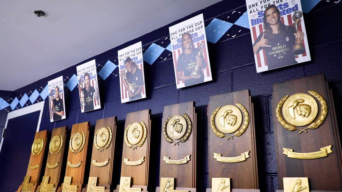 Championship trophies and photographs of former UNC-Chapel Hill women’s soccer players who played on the U.S. Women’s National Team that won the World Cup in 2019 are seen in a trophy room at the McCaskill Soccer Center in Chapel Hill, N.C. on June 15, 2021.