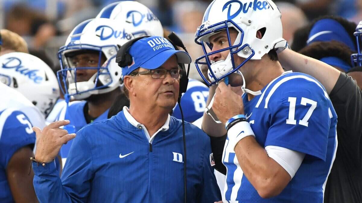 Duke head coach David Cutcliffe speaks with quarterback Daniel Jones (17) in the first quarter after a series of plays. Duke opened the 2018 football season with a win against Army 34-14 at Wallace Wade Stadium in Durham, N.C., Friday, August 31, 2018.