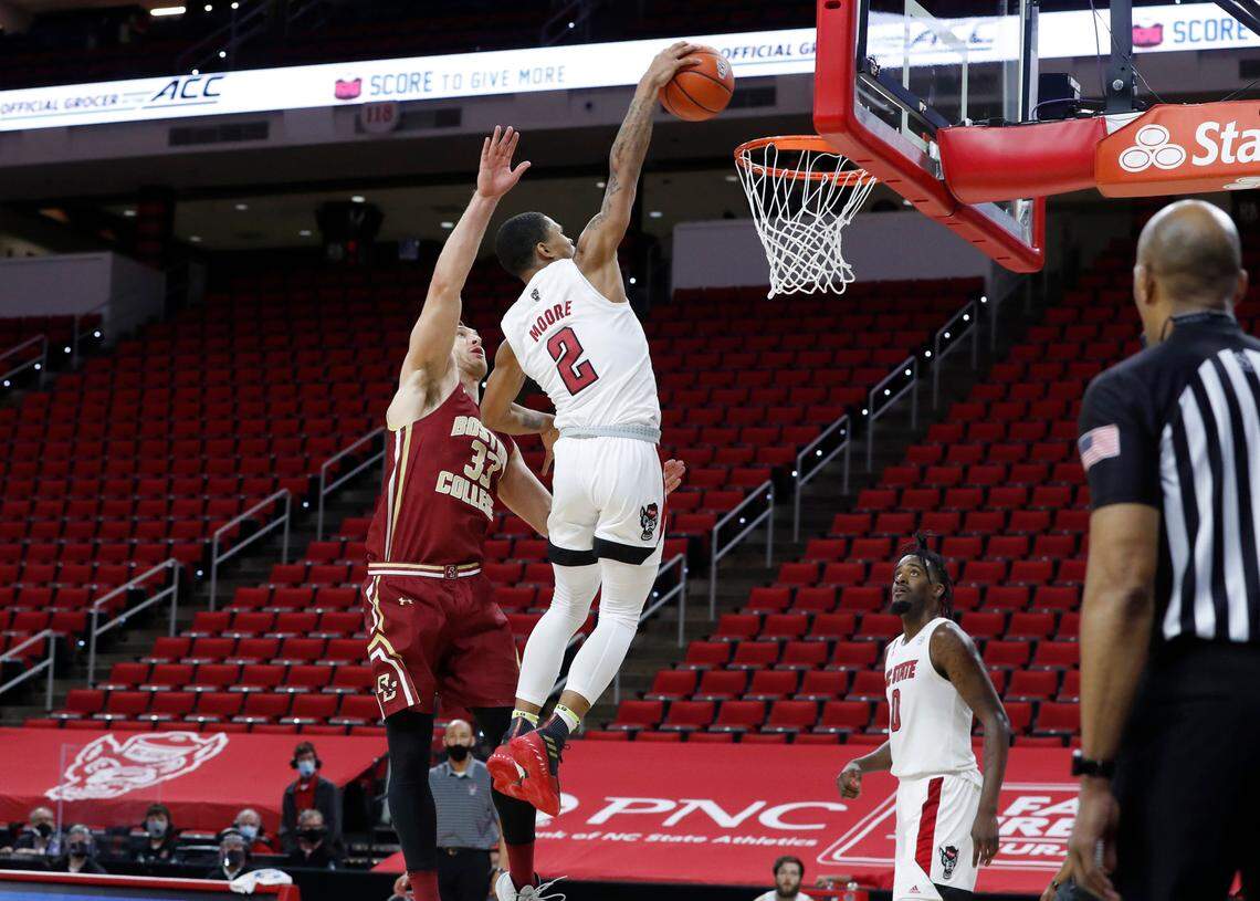 N.C. State’s Shakeel Moore (2) heads to put in two as Boston College’s James Karnik (33) defends with two seconds left during N.C. State’s 79-76 victory over Boston College at PNC Arena in Raleigh, N.C., Wednesday, December 30, 2020.