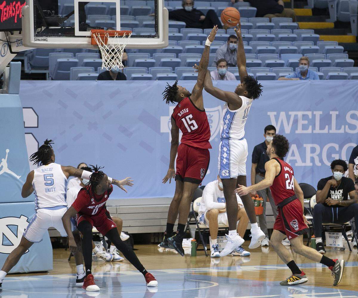 North Carolina’s DayÕRon Sharpe (11) puts up a shot over NC State’s Manny Bates (15) during the second half on Saturday, January 23, 2021 at the Smith Center in Chapel Hill, NC.